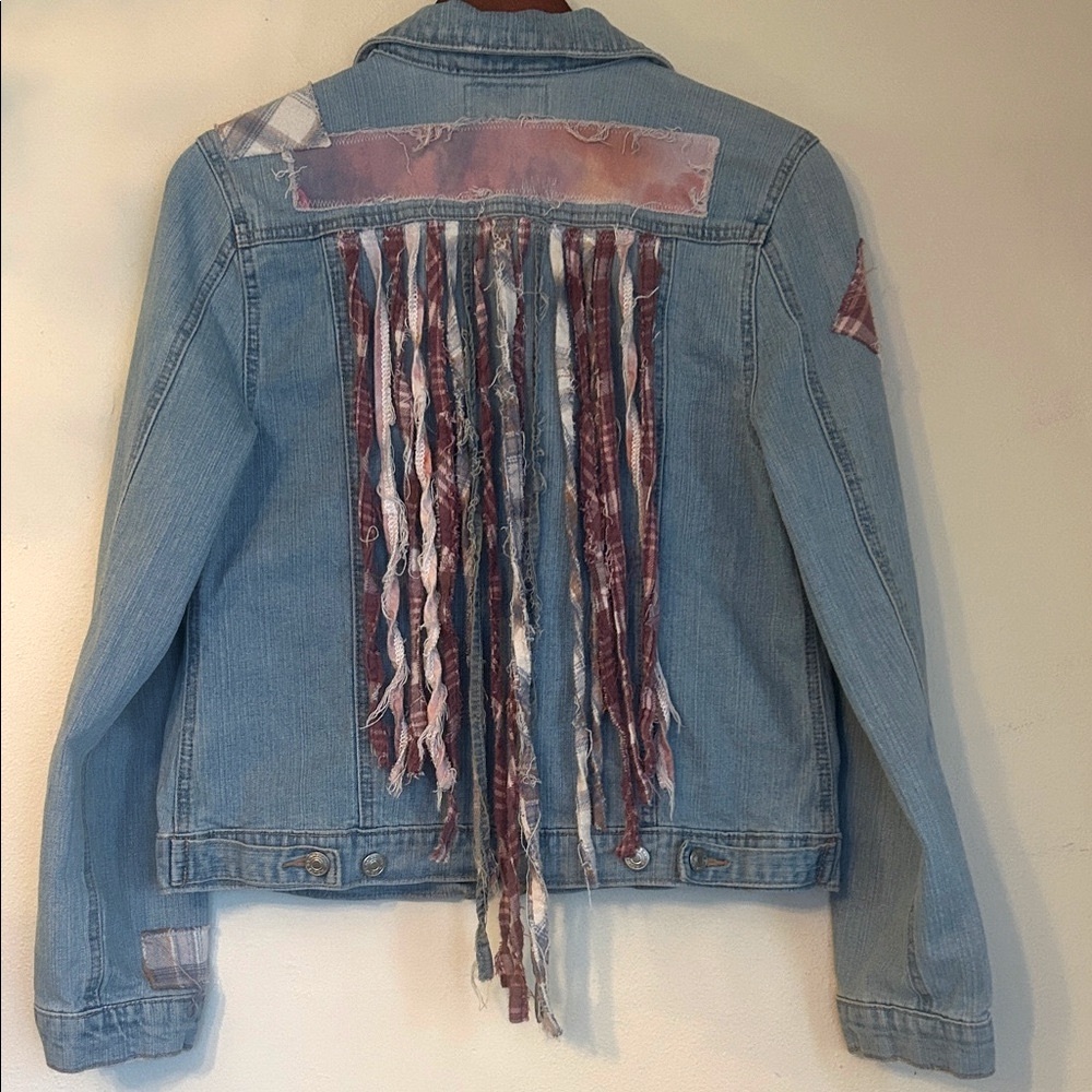 Upcycled flannel patched fringe back jean jacket